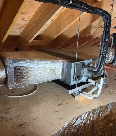 Concealed ducted mini-split air handler installed in an attic by AFAB Construction