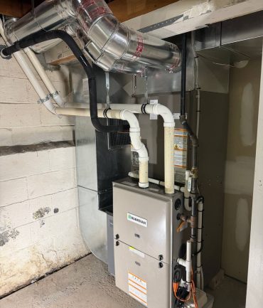 High-efficiency Guardian gas furnace with new sheet metal ductwork installed by AFAB Construction