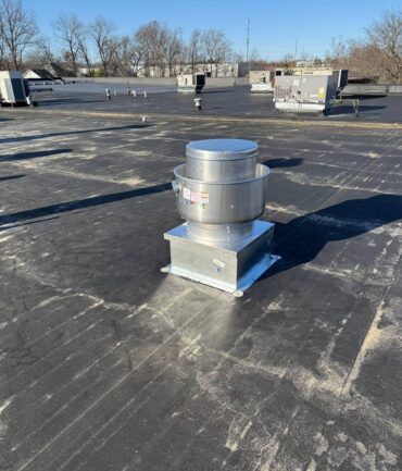 Commercial rooftop exhaust fan installation on a flat roof, NJ